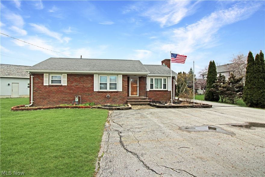 Come check out this brick ranch just outside the city limits! It's a three-bedroom, one-full-bath home with two large living spaces. Plus, it has a large two-car garage with a workshop attached (with a half bath). There is also a greenhouse for your gardening needs!