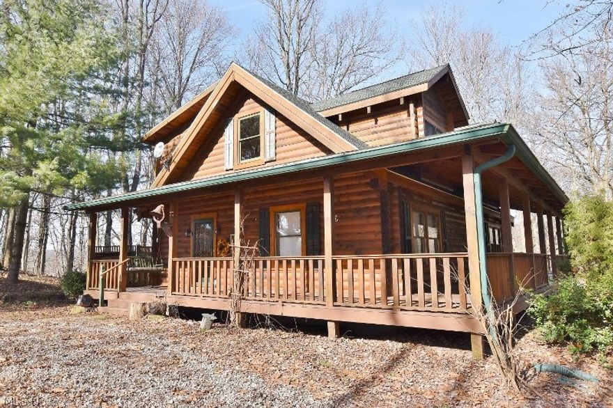Secluded 3 Bedroom/ 2 Bath Cape Cod log home only 5 minutes from Dover on 5.9 amazing wooded acres with a private pond. Huge wrap around deck to enjoy the tranquil setting of this fabulous home. Newer roof is approximately 3 years old on the house and garage/workshop. Phenomenal great room with a towering wood burning heatilator fireplace. Charming wood floors through most of the home. Open concept common area encompasses the great room, dining area and kitchen. The kitchen features Schrock cabinets, large island, Décor dual fuel range, newer refrigerator and dishwasher. Patio doors lead to the deck from both the dining room & great room. Additionally on the main floor are two bedrooms and a full bath as well as a foyer. The upper level includes a spacious loft with piano (included) and a magnificent master suite. You will love the large walk in closet & private master bath with jetted tub & separate oversized shower. 13 course walk out basement offers numerous options for additional l