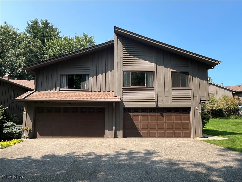 Nestled among mature trees and in a serene park-like setting, this maintenance-free home has everything you have been looking for! This three bedroom oasis is situated close to highways, shopping, restaurants, hike/bike trails, the Metroparks and hiking access to the Cuyahoga Valley National Park- while providing amazing amenities like a clubhouse w/meeting rooms and exercise facility, indoor/outdoor pools, sauna, tennis/pickleball courts, playground, walking trails, and loads of common space. The home itself has been completely updated throughout with sleek modern fixtures and neutral colors. You are welcomed to the home by a private courtyard patio that leads directly into the foyer area. The open-concept first floor boasts a large living room with wood beams and fireplace, dining room space and additional sitting area. The gourmet kitchen is centered by a large waterfall quartz island, stainless steel appliances and sleek cabinetry. There is a beautifully updated half bathroom on the first floor, along with direct access to the attached 2-car garage and sliding glass door that leads to the back patio. The upstairs is open and airy with an additional large living space that has a 2-sided fireplace and access to the recently renovated Juliet balcony. All three bedrooms are on the upper level and boast large closets and bright windows. Both full bathrooms are completely updated and give ample space for guests. The laundry room is conveniently located between all of the bedrooms in the upper-level hallway. Major updates to the home include the HVAC, windows, electrical panel and grounding rods, garage door opener, air exchanger and more. Do not miss your opportunity to own this desirable home in the highly sought after neighborhood of Greenwood Village. Call TODAY for your private showing!