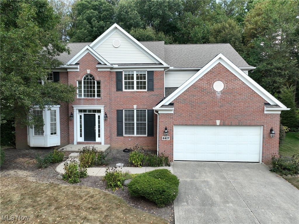 Move right into this 4-bedroom, 2.5 bath brick Colonial in the sought-after Kingsbury Crossing neighborhood of Copley Township. The chef’s kitchen is the heart of the home, featuring a Viking Range, center island, and walk-in pantry, and opens seamlessly to the dramatic 2-story Great room with a wall of windows overlooking the flat backyard. A slider leads to the deck and back patio, perfect for outdoor entertaining. The main level also features a formal living room and dining room, a private office/den with a see-through fireplace (potentially serving as a first-floor bedroom), a laundry room, and a half bath. Upstairs, you will find the spacious owner’s suite with wooded views, large walk-in closet, and private bath. Three additional bedrooms and a full bath complete the second floor. Further highlights include a 2-car garage and an ideal location just minutes from the Montrose Shopping District, I-77, I-21, and I-71. Optional Kingsbury Recreation membership fee includes access to community pool, tennis/pickleball courts, playground, clubhouse/common facility, and walking trails. New Copley Community trail being added currently.