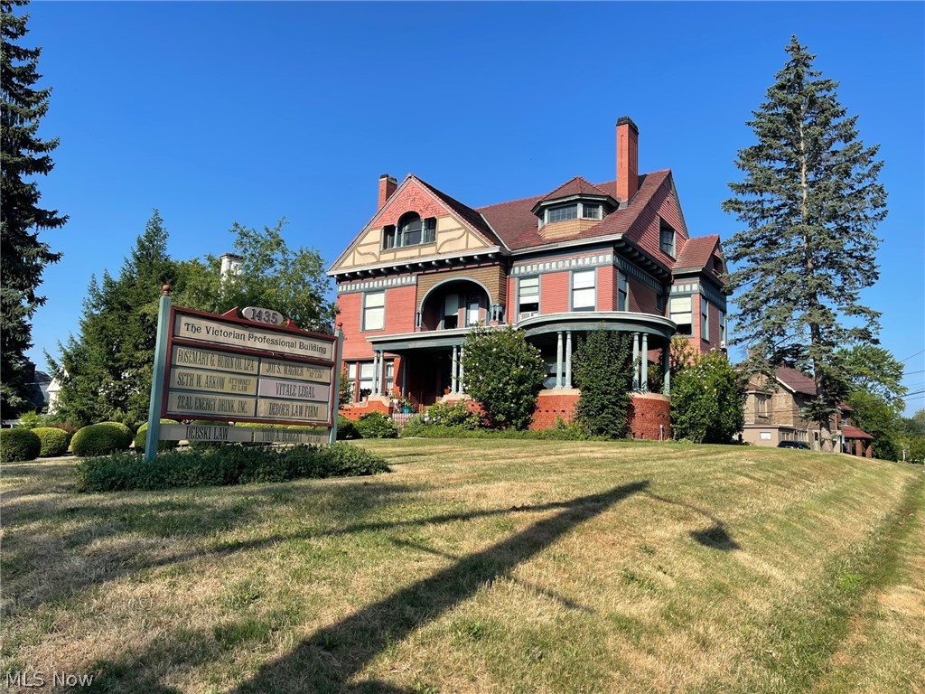 For Lease: One office and common space in the beautiful Victorian Professional Building. Property was professionally remodeled. This former home is an historic landmark that is listed on the National Register of Historic Places in Stark County. It was built for George E. Cook the owner of Princess Plow Co. The property is on .46 acres and is located on the corner of Market Ave. N and 15th St. NW. It has fabulous Victorian period details such as leaded glass, stained glass, wood floors some with parquet inlays, beautiful wood staircases, trim, doors, built-in cabinetry, exposed ceiling beams and tiled fireplaces with decorative mantles. Spacious kitchen and butler's pantry has floor-to-ceiling built-in wood cabinetry. The first and second floors have 10' ceilings. There is also another full bathroom. The full bathrooms are spacious and have all the Victorian details. The half bathroom is on the first floor. Side entrance carriage porch. Unique and beautiful covered front porch with circular end and lovely landscaping. Handicapped accessible. The roof is red tile. Parking in rear of building.