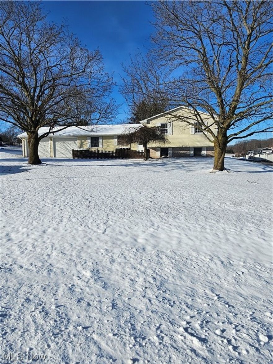 You will love this split-level home in a quiet neighborhood just outside of Salem!! The detached garage is the perfect for a woodworker or powersport hobbyist and the rear three season room adds additional square footage for you to enjoy the country views. Inside you will enjoy spending those cold nights in the lower-level family room with the natural gas stove. The attached two car garage offers easy access to the eat in kitchen. Upstairs, the bathroom is accessible from the hallway and the master bedroom. This home is adorned with many closets and ample storage space. There is a large lower-level laundry room with an additional enclosed shower and extra storage. The entire home has received a fresh coat of paint and is ready for immediate occupancy. Don't miss this great opportunity to own an affordable home in a desirable and well-established neighborhood!! Call and schedule your showing today!