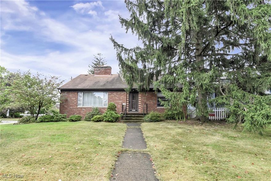 Long time one owner brick, cape cod home in a coveted neighborhood on the north end of Parma. This is not your typical Parma cape, with over 2300 sq ft of above grade living space, 3 possible 4 bedrooms, 2.5 bathrooms and a partially finished lower level. The charming first floor features original hardwood flooring, built-in bookshelves, gas fireplace with marble surround, marble window sills all in tact and a desire-able floor plan. The eat-in kitchen with ample cabinetry and counter space plus a built-in buffet and display cabinetry. Opens to a formal dining room and a bonus first floor potential office space at the back of the home. The beautiful front living room with tons of natural light, fireplace and built-ins, is ready for the next generation of family gatherings and memories to be made. Two great size first floor bedrooms, either of which could be a primary bedroom, both with large closets, overhead lighting and hardwoods. Tons of storage including a coat and linen closet in the hall off the tiled entry foyer. Full bath with original tile, tub/shower combination, built-in makeup vanity is a vintage masterpiece. Head upstairs to a massive second floor bedroom with continued hardwood flooring, two closets, plus bonus room space for nursery, bedroom or dream walk-in closet. Large half bath makes this a wonderful potential 2nd floor primary suite or incredible space for the kiddos. Once home to a family of 10! Lower level has tons of potential with enormous laundry, storage, workshop, additional shower/toilet and awesome rec space. Carpeted rec room has additional gas fireplace and a large built-in bar host to many holidays and celebrations. Paver patio and detached 2-car garage. Located across the street from Evergreen Lake in a neighborhood where you will find dog walkers, deer, geese and the occasional turtle. Minutes from Big Creek Parkway and the Metropark, Shnitz Ale, Shnitzel Haus and Chuppas Marketplace.