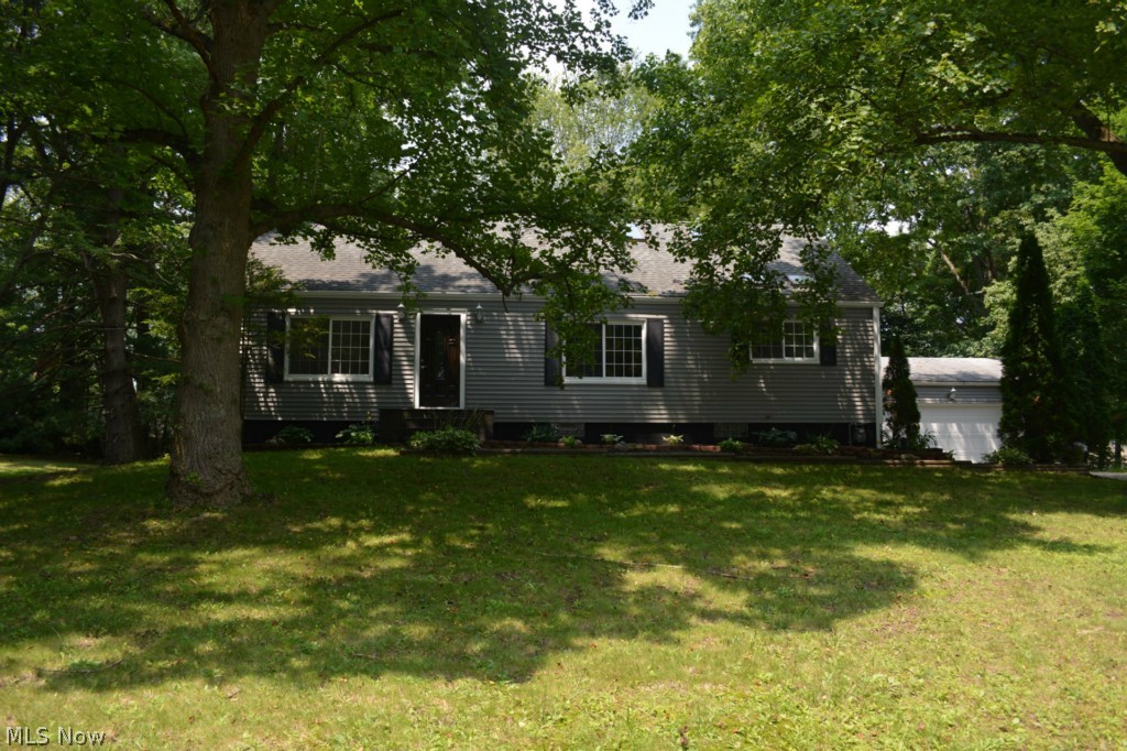 3722 Seneca St., Stow, OH 44224; Looking for plenty of room, nice yard, and all the work is done for you? LOOK NO FURTHER! This amazing Cape Cod is on a quiet dead end street with a huge treed yard with plenty of room for family activities. Every room in the house has been redone. Check out the photos! Starting at the beautiful front entry door, this home features new trim, paint, flooring, and fixtures just about everywhere! The living and dining rooms feature tastefully re-done hardwood floors with a rich, dark finish. The kitchen is first class with new cabinetry, granite counter tops, beautiful ceramic tile floor, and new paint and trim. A bonus room off the kitchen, the "sun room", can be used as a breakfast area or an office/library. Both full baths are completely re-done and well appointed and feature new fixtures and ceramic tile floors. All the bedrooms are fresh with new paint, trim, and carpet. Upstairs could be a private owner's suite with a huge bedroom, beautiful en su