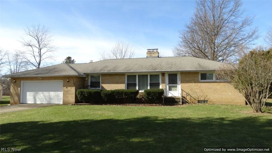 SOLID BRICK RANCH set on 1 park-like acre! This home offers 3 Bedrooms, 2 Full baths, Living Room with sandstone wood burning stove insert & large picture window, Eat-in Kitchen with all appliances open to Dining Room & Family Room with stone wood burning fireplace & sliders to brick patio. Original hardwood floors in bedrooms & under carpet in Living Room & Office/Den. Central air. Newer vinyl windows & furnace. Full unfinished basement with newer glass block windows. 2-car attached garage plus large outbuilding with water access. West Geauga Schools. With your decorative touches, make this home your own!