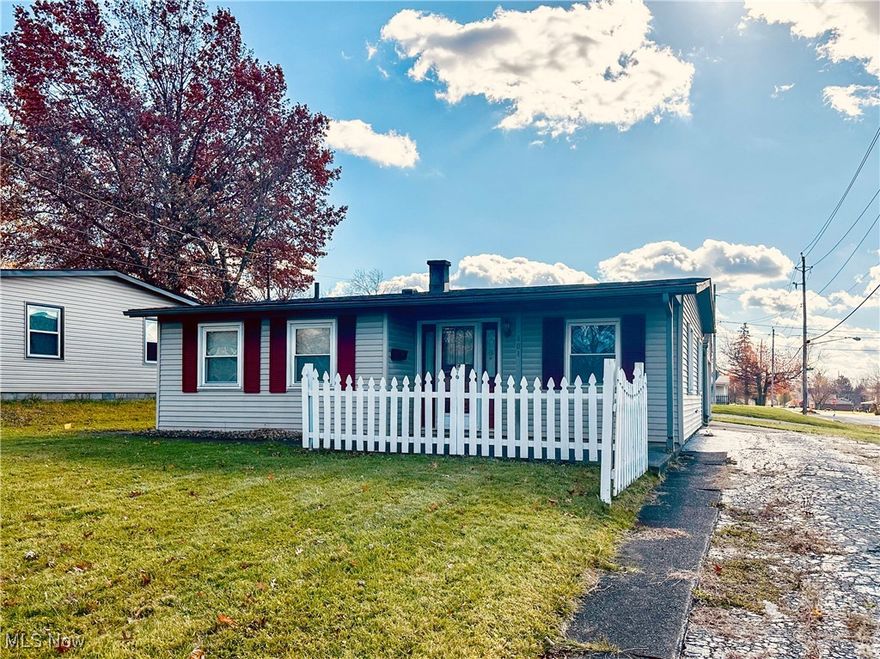 Discover easy one-level living in this cheerful ranch-style home set on a convenient corner lot. The covered front porch leads you into a spacious living room, a dining area with a fun bar ledge for extra seating, and a well-equipped kitchen with appliances and ample cabinet space. An inviting den/office could serve as a third bedroom, offering flexible space to fit your needs. Down the hall, you'll find a dedicated laundry area with a full-size washer and dryer, two bedrooms, and a nicely updated bath featuring a walk-in tile shower. You'll appreciate the abundant closet space throughout the house. A covered breezeway - complete with a storage shed - leads to the oversized one-car garage with work and storage space. A small fenced backyard provides just the right amount of outdoor area without the upkeep. Additional highlights include an extra driveway for parking, a BRAND NEW roof on the house and garage, and a low-maintenance design throughout. Conveniently located near shopping, dining, hospitals, Youngstown State University, and major interstates, this home offers comfort, practicality and accessibility in one great package!