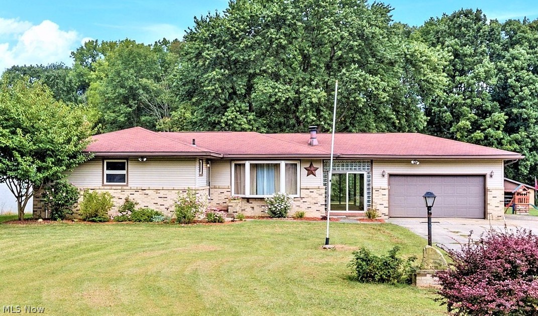 WOW ~ 2,000 Sq. Ft RANCH Including FINISHED Basement, 3 Bdrms, 1.5 Bath, 2 CAR Attached Garage PLUS 2 CAR Detached Garage = 4 CAR GARAGE AND 1.5 ACRES! Manchester LSD, Residential Established Neighborhood! *Long & Wide Concrete Driveway Extended To The East Of Home Accomodates 6 Vehicle Parking Comfortably! *475 SQ. FT. TRIPLE Tier DECK! *Tall 12'+ Ceiling In Detached Garage For Trucks/Suv's/Boat! *New Laminate Flooring Throughout Living, Dining & Main Hallway *Finished Basement W/Beautiful Modern Waterproof Shaw Asheville Pine LUXURY Plank Flooring! *Walk In To The Generous Sized Living Room W/Bay Window & Gas Fireplace! *5 Light Chandelier In Dining Open To Kitchen W/GAS Stove & Refrigerator *Real Brick Accents Contribute To The Charm And Rustic Feeling Of This Kitchen! *PANTRY Beside Kitchen For Extra Food Storage! *SUPER NICE Totally Enclosed 21 Ft. Long Breezeway W/Globe Pendant Lighting Is An EXTRA RM Flanked By Sliding Glass Doors In The Front + In The Back, With Glass Block Sid