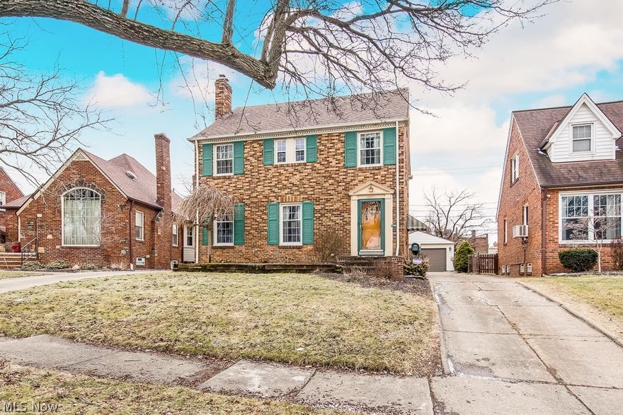 Welcome to this lovely all-brick colonial featuring the perfect blend of classic charm and an updated, modern color scheme and located in the beloved West Park, Kamm's Corner Neighborhood.Cozy and quiet, perfect for enjoying quiet time at home, but with a versatile floor plan, also a great place for entertaining.
As you enter,  natural light beams onto gorgeous hardwood floors, and the gas fireplace in the living room serves as a beautiful focal point drawing you into the expansive formal dining room, which features a door leading to the back porch, overlooking the fenced-in backyard. The updated kitchen is a chef's dream, with tons of counter space, stainless appliances, including a gas range. Enjoy breakfast next to the window in the lovely eat-in area, or use this space to create a coffee or cocktail bar or as an excellent location for laying out a spread of appetizers. Retreat upstairs to the primary bedroom featuring a walk-out patio space and two other spacious bedrooms, along w