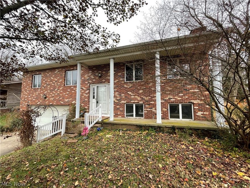 Amazing  LOCATION LOCATION LOCATION in Canal Fulton  with half an acre.  This home has been in the family for 45 years and is on market for the first time!   Featuring:  Brand new vinyl plank flooring in kitchen.  Brand new carpet throughout entire home.  3 bedrooms. Possible four. The  Master bedroom with his and her closets and private master ensuite with walk in shower!  Full bath on first floor and a half bath on the lower level.  Pick your paint colors to make this home YOURS.  Newer furnace and roof.  Lower level Family room is cozy with fireplace.  Front porch sitting with stately pillars.  Sunporch off the dining room for easy access to back yard.  Partially fenced just perfect for your four legged fur babies to stay safe!  Priced to sell so schedule today!