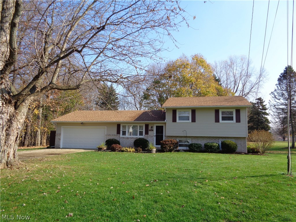 Wonderful split level in Lake Schools district. Landscaped large yard with plant drip system, a private patio, storage shed, and located in a cul de sac. Three bedrooms, master bedroom with 1/2 bath, and 2 more nice bedrooms with great closets. Living room has large quest closet. Kitchen has stove, refrigerator, dishwasher, microwave and newer faced hickory front cabinets and a built in desk. Lower level with large family room, also a room that could be office/playroom etc and utility room with washer and dryer. Many updates throughout the home. Roof, siding, and front door 2014. Furnace and central air 2007. Ready to move in.