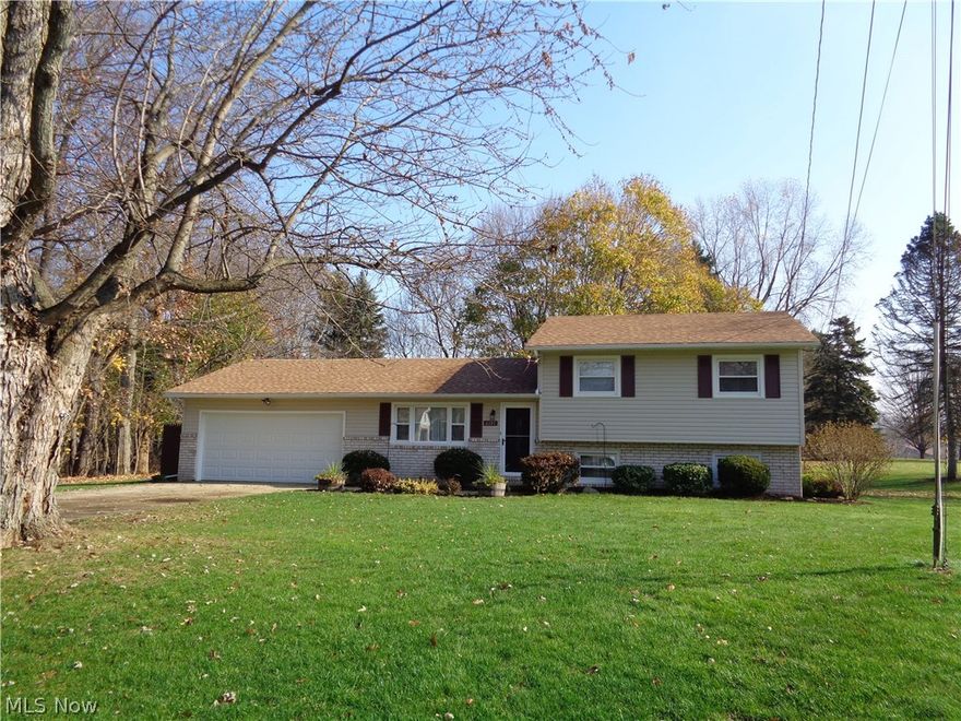Wonderful split level in Lake Schools district.  Landscaped large yard with plant drip system, a private patio, storage shed, and located in a cul de sac.  Three bedrooms, master bedroom with 1/2 bath, and 2 more nice bedrooms with great closets.  Living room has large quest closet.  Kitchen has stove, refrigerator, dishwasher, microwave and newer faced hickory front cabinets and a built in desk. Lower level with large family room, also a room that could be office/playroom etc and utility room with washer and dryer. Many updates throughout the home.  Roof, siding, and front door 2014.  Furnace and central air 2007.  Ready to move in.
