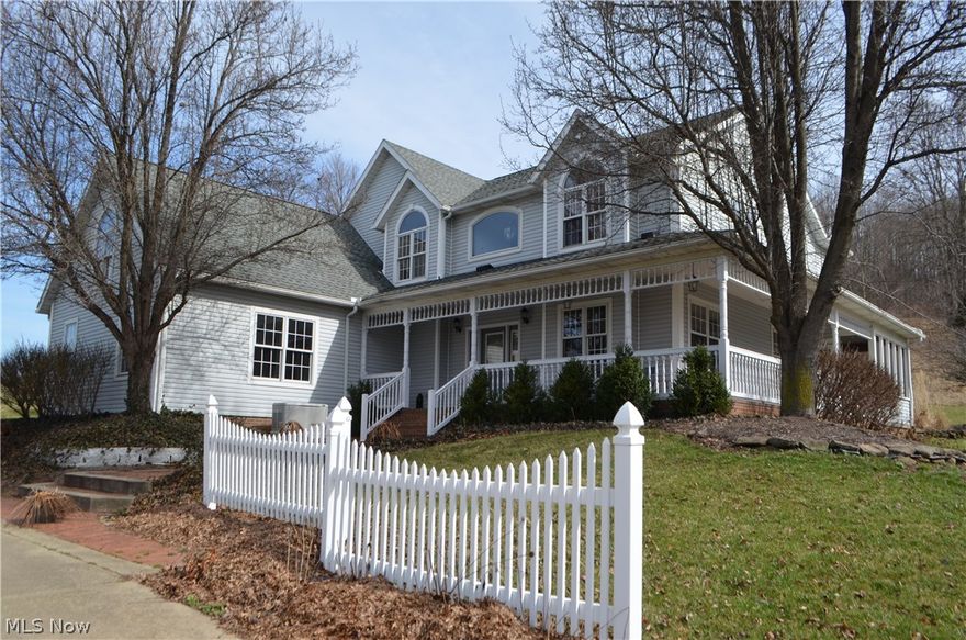 This perennial paradise is a gardeners dream. Exceptionally well maintained, the home features solid hardwood mouldings and trim, large kitchen with formal dining room and living room with access to enclosed sunporch and patio area that connects to a wrap-around porch. A beautiful wooden stairwell leads to the second floor which features 4 large bedrooms, full bath, and master suite. The walk out basement is completely finished with a full kitchen, bath and large living room. Included with the property is a 2 car attached garage and 38x48 detached shop/garage.