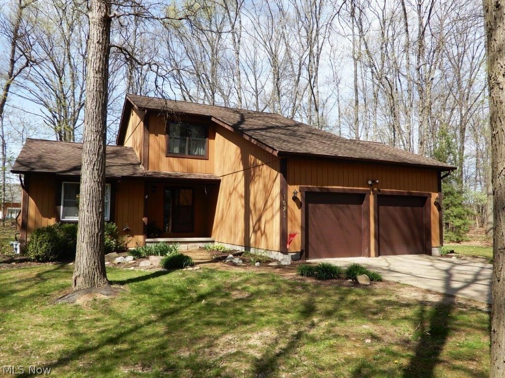 Gorgeous cedar Hudson home nestled in a beautiful wooded setting, there is nothing vanilla about it! From the generous flowing floor plan to the multi-level wraparound deck and spacious yard you will fall in love with this one over and over. The main floor features a large living and dining room, kitchen has all appliances included and opens to a cozy den with a stone wood burning fireplace and sliders to the back yard! There is also a bright 4 season sun room that would make a perfect office, play room, or morning room! The first floor is completed with a modern half bath, first floor laundry, and 2 car attached garage. Upstairs offers a spacious master with walk-in closet, two nice sized bedrooms, and a newly updated full bathroom w/dual vanity! The basement offers a huge finished rec room w/low-maintenance laminate flooring, a second finished play/rec area, AND a workshop with bench and crawl space for additional storage! Out back is a wrap around deck perfect for all entertaining n
