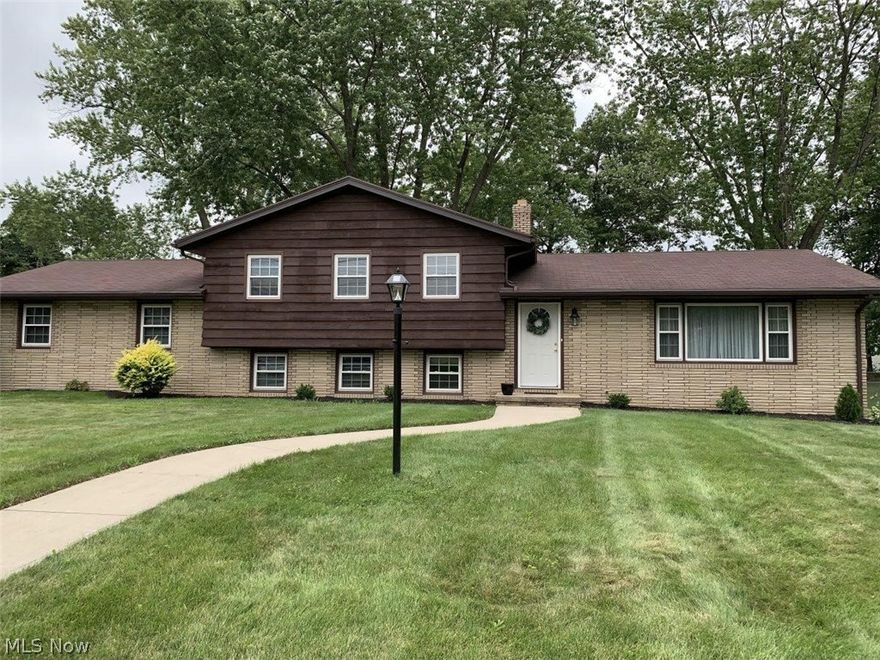 Nothing to do but move in and start enjoying this spacious 3 to 4 bedroom, 2 full baths, brick and cedar home on a large wooded
corner lot in Perry! Everything has been refreshed; white kitchen with granite countertops, stone tile backsplash, new stainless sink and appliances,
and unique brick feature wall with indoor grill. Custom brick and wood divider flows to large and open living room and dining area with lots of natural
light. The ground floor family room features a wood burning fieldstone fireplace, new laminate floors and is adjacent to the convenient office or 4th
bedroom with two closets and full bathroom. The top floor has three sizable bedrooms with beautiful hardwood floors and plenty of closet storage
including a hall closet and a full bath directly accessible from the master or hall. The dry and well lit basement has laundry area and glass block
windows with vents. The two car garage has room for extras, large concrete driveway with turnaround. This home has vinyl