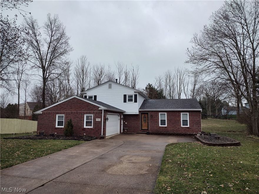 Welcome to beautiful Medina and this lovely split level located on just a little over a half acre. This home has been lovingly cared for and is extremely clean inside and out. As you enter the home you are greeted by a generous foyer and coat closet with expansive views of the large family and dining rooms. Forward into the wonderful modern kitchen complete with granite countertops and full size backsplash. As well as all stainless steel appliances. The kitchen overlooks the fantastic living room with a spectacular brick fireplace to keep you warm on cold evenings and hardwood flooring. Off this room we find a half bath, a bedroom, and laundry/utility room leading to the 2 car garage. Upstairs we go and notice the beautiful wood floors throughout all 3 bedrooms! A large full bath is also located upstairs that offers a shower with jetted tub, linen closet, ceramic tile floors that extend onto the walls as well. Bathroom is accessible from the largest bedroom. Outside you can relax on th