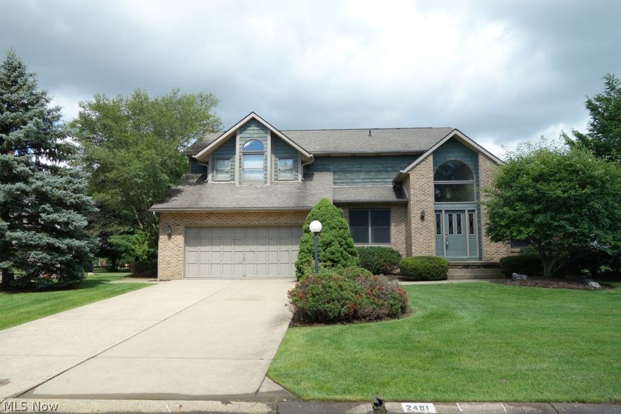 Fantastic location positioned beautifully on gorgeous lot in Bob O’ Link! Beautiful wood floors greet you as you walk in and lead to a formal living room with brick fireplace and cathedral ceilings.The open eat-in kitchen has stainless steel appliances and is open to the family room making for great entertaining.  Built-ins grace either side of the family room fireplace and French doors lead to the all season room with wood ceiling that gives access to a very pretty backyard and large deck. The finished lower level adds more room bringing total square footage to approximately 3100. Very large master suite with pampering master bath.  The walk-in closet will knock your socks off! Enjoy how convenient the location is to schools, shopping and I-77. Plain Township, North Canton School District.