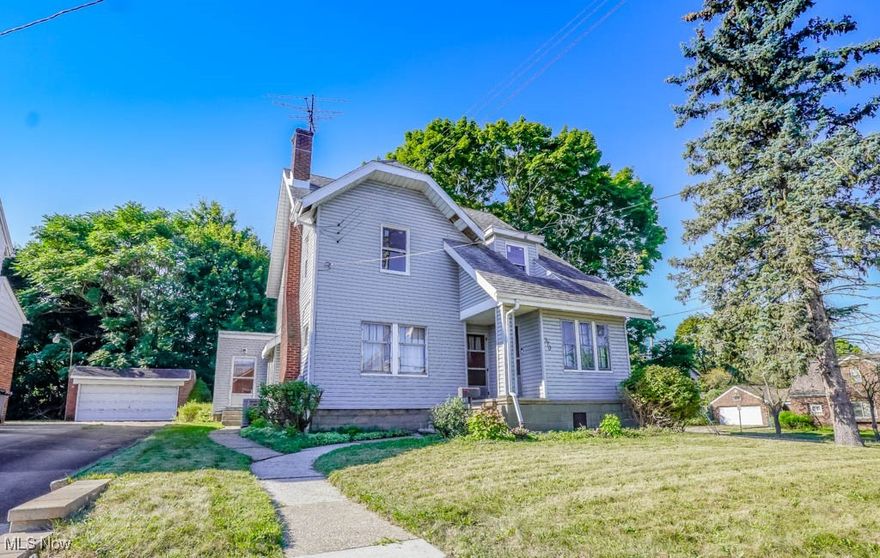 Spacious and full of character, this North Hill colonial offers over 2100 square feet of living space, making it a great fit for a growing family or anyone who wants extra room. The living room is filled with natural light from a large picture window and features a fireplace framed by built-in bookcases. A versatile bonus area nearby is perfect for a home office or playroom. Hardwood floors continue into the dining room, where wide trim, crown molding, and built-in storage add timeless appeal. The kitchen has plenty of cabinetry and opens to a comfortable family room with a beamed ceiling, its own entrance, and sliding doors that lead to the backyard. Upstairs, three bedrooms with hardwood floors share a full bath, while the finished attic provides a fourth bedroom complete with a walk-in closet. Even more living space can be found in the basement with knotty pine walls, a second fireplace, and a half bath. A two car garage and double lot complete this wonderful home, so call today to schedule your showing!