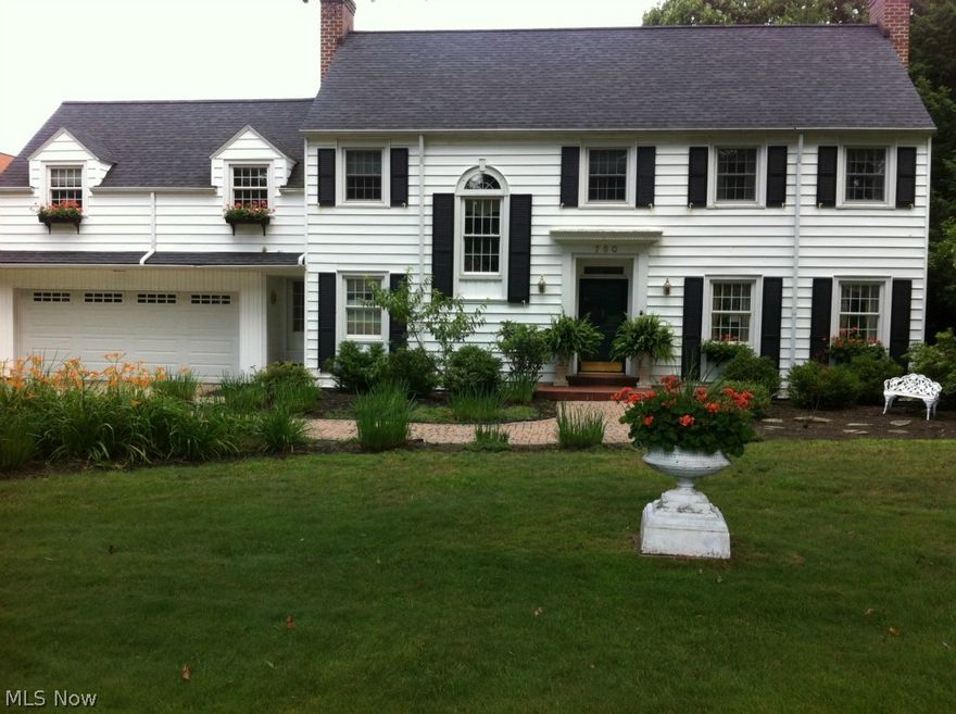 Spectacular luxury on 1.3 acres in the city. Private tiered lawn lush landscape. 4 bedrooms, 3.5 baths. Newer cherry kitchen, granite counters, updated appliances. Baths redone with ceramic, granite marble. Wood floors, crown molding, newer windows, security system, inter com, 4 fireplaces, custom window treatments, updates electric. A/C. Mostly finished basement, walk up attic. Large patio. Quality through out this custom home.