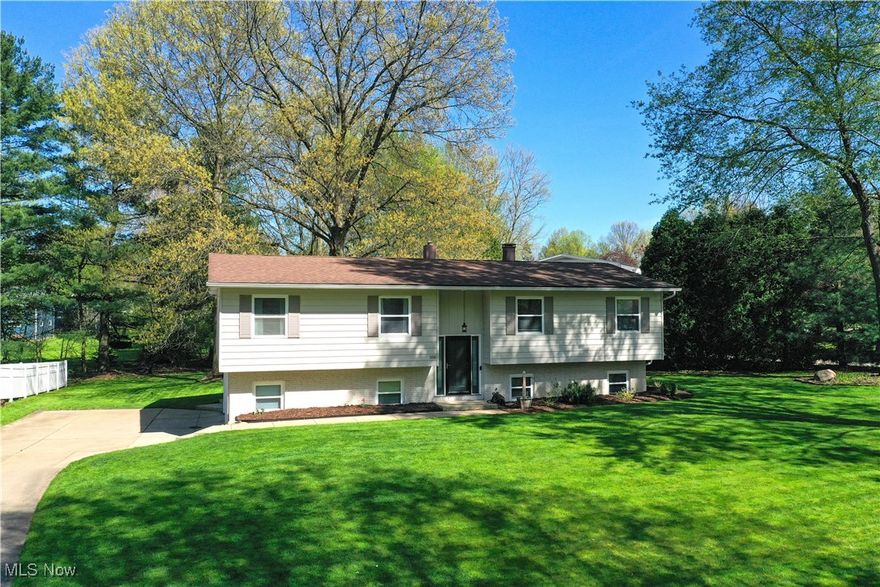 Lovingly cared for home in highly desirable Tallmadge Woods. Upon entry to this Bi-level home, you will immediately notice the abundance of natural lighting. The large living room flows directly into the dining and kitchen area. All kitchen appliances are included with the sale. Sliding doors provide access to your private deck. Three generous sized bedrooms and a full bath complete this level of the home. The lower level has a large family room with a fireplace and light from exterior windows. A second full bathroom and laundry room are also located on this level. This allows direct access to your oversized two car garage. Enjoy private evenings on your paved patio. Your next home could be a phone call away. Contact for an appointment today.