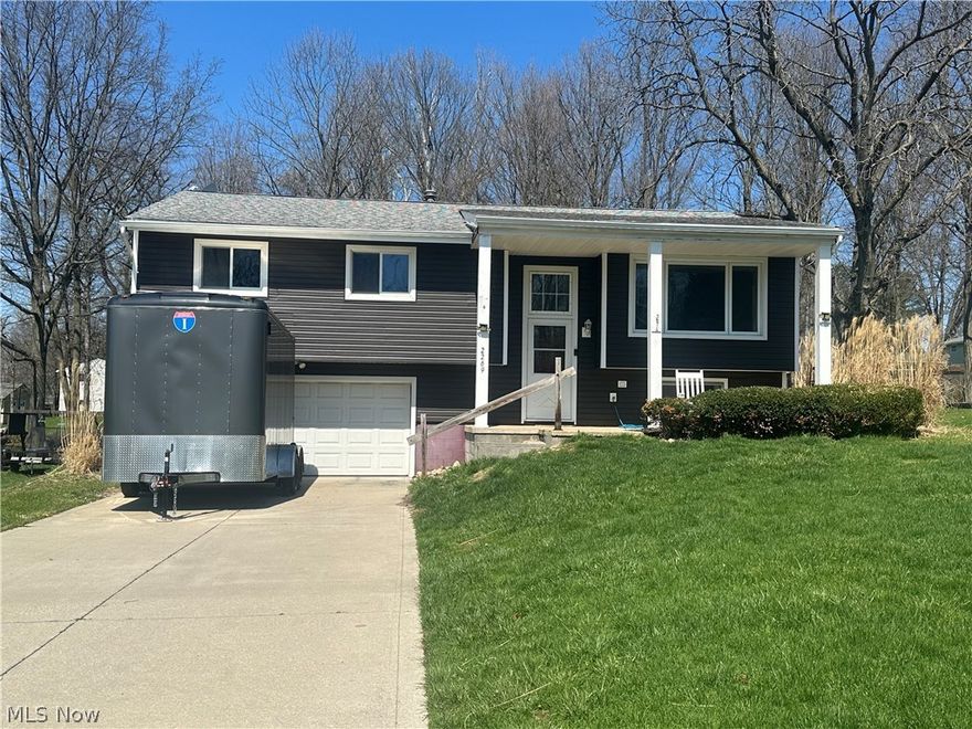 Welcome to this move-in-ready, 4-bedroom, 1.5-bathroom bi-level in the heart of Twinsburg. Fresh, Bright, and Ready for You!
The interior boasts new fresh neutral paint and plush new carpeting throughout, providing a clean and inviting canvas for your personal style. Three nice size bedrooms and a full bath are on the main floor. A large kitchen over looking a dining area and front room top off the upper level. The lower level has an additional bedroom, rec room or office. Just outside the bedroom is an additional bathroom and laundry area. The lower level does have a walkout to the back yard. The home is situated close to parks, shopping and entertainment. Furnace/ AC (2008) Roof (2007) Siding (2021).