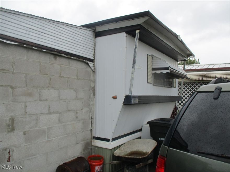Seller has Taken Carport/Patio area and has Transformed it into a Block Addition used for Work Space or Possibly used to be Dry Walled for Additional Living Space*In Suite Laundry* Full Bath and 2 Bedrooms*New Furnace and Water Tank*Easy to Show*