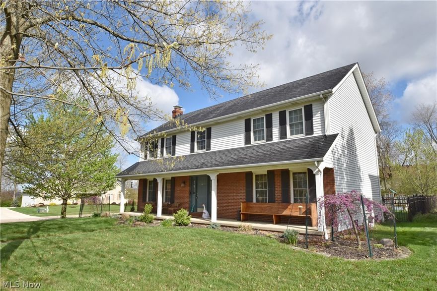 Pride of ownership is evident in this attractive 4-bedroom, 3.5-bath colonial in North Royalton. The gracious entry welcomes you to the home and includes a nice-sized coat closet. The spacious dining room with loads of natural light is highlighted by a hearth with wood beam mantle and wood-burning fireplace, offering an inviting gathering space for family and friends. The cheerful kitchen has been thoughtfully renovated with attention to both aesthetic and function, including dolomite countertops, fabulous work space and storage, and stainless appliances, all of which convey with the home. Relax in the cozy library with its wall of built-ins for display and storage, and in the comfortable family room. A combined laundry/mud room with lockers offers easy storage solutions; the conveniently located half bath completes the first floor. Continue upstairs where you will find three nice-sized bedrooms with sizable closets. These bedrooms share an impressive full bath with dual sinks and modern finishes. The owners’ bedroom is generously-sized and light-filled, complemented by a walk-in closet. The primary bath is gorgeous and includes a soaking tub, shower, double sinks, and vanity desk. The home’s lower level is partially finished for additional living space and includes a kitchenette; built-in storage; large, full bath; and possibilities for a workshop, craft room, or home office. Unwind on the back deck and front porch; enjoy the mature trees and landscaped yard. Three-car garage with shelving; water and electric are available. This home has been routinely updated over the past several years, including: new carpet in all bedrooms (2026); complete kitchen renovation (2022); replacement of all but four windows throughout the home (2018-2022); full makeover of two upstairs baths (2021) and new A/C unit (2021). Sellers are providing a one-year home warranty for peace of mind. Make an appointment today to see this fantastic home!