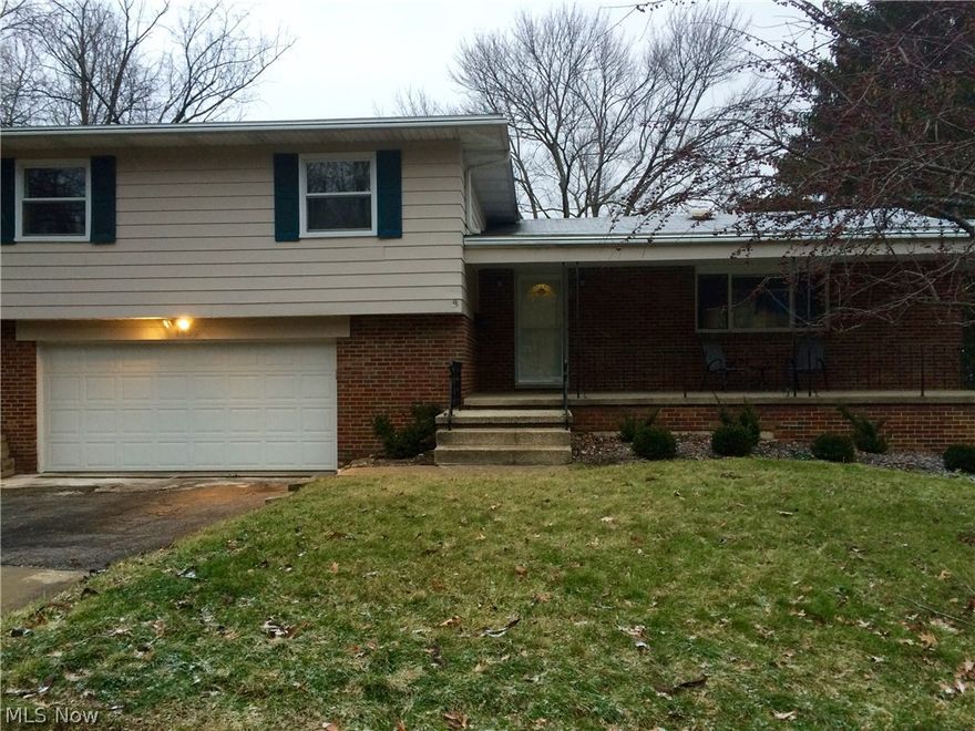 Beautifully updated split level in a desirable West Akron location! There is so much to appreciate about this home. Not only is there a lovely formal dining room with hardwood floors, but the spacious eat-in kitchen has stainless steel appliances that stay, and new tile (2011) & counter tops! Enjoy two living spaces – one with a charming wood burning fireplace with blower. Outside, you will find two of the highlights of this home: a 502 square foot deck (new in 2013) that is perfect for the warmer months and a backyard with great depth and a new fence around the back. The bathrooms have important updates - new tile floors (2011) in master and half bath, new tiled master bath floor (2015), & 2nd full bath countertops. The walkout basement offers tons of storage space due to a wall of built in cupboards and has a separate room with door that is perfect for a work space. Some other great features: a very nice 2.5 car attached garage, interior French drain w/sump pump, good sized foyer/ent