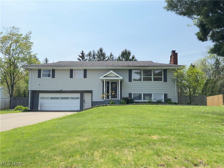 Welcome to this 4 bedroom, 2.5 bathroom bi-level home in Marlington LSD located on a dead end street. The lower level offers a spacious living room that opens to the beautiful kitchen. Off of the kitchen you will find a sunroom that leads to the fully fenced back yard. A full bathroom completes the newly updated lower level. Heading to the upper level you will find another open living room/family room, with an area off to the side for an office or whatever extra space you may need. Down the hallway are the 4 spacious bedrooms all with the original hardwood floors and JUST professionally painted on 4/4/25, one of which has an attached half bathroom! To finish off the upper level you will find the second full bathroom with a new bathtub/surround, as well as new tile flooring just installed in April 2025. This home has so much to offer from the spacious floor plan, to the heated/cooled garage and fully fenced back yard with a hot tub! You will find a ton of updates consisting of a hot water tank from 2021, furnace and a/c from 2022, and lower level flooring and bathroom, plumbing, electrical, doors, trim, fresh paint, and appliances in 2024. A 1 year home warranty is being offered for buyer's peace of mind.