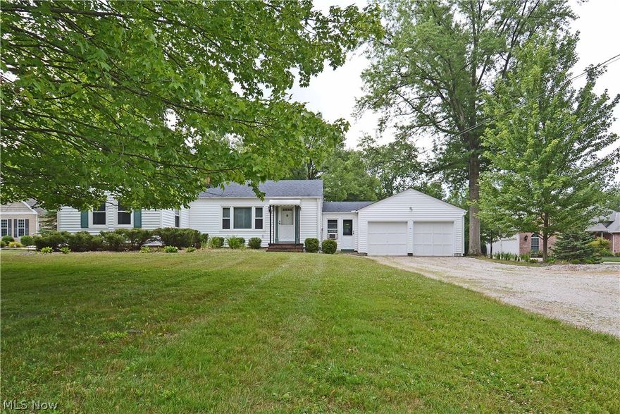 This charming three-bedroom ranch style home with a spacious living room, eat-in kitchen, and full bath on the main floor has a warm family history. Built on part of the family farm, the land had many fruit trees and large vegetable gardens. The dining room fixture was from a mansion on Millionaires' Row. The house has been in the same family since it was built. Some recent improvements include newer windows, vinyl siding, roof, and basement stabilization. The lot has 100-foot frontage and is approximately 630 feet deep, measuring 1.4648 acres of land. The 1400 sq ft home has a breezeway between the house and the two-car garage. There is a man cave, home office, or just an out of the way room off the back of the garage. It was used as an insurance office for many years with an exterior door for clients to enter without having to go through the garage or the house. The long driveway with a turn around provides ample parking for gatherings. The interior of the house needs updating. It is