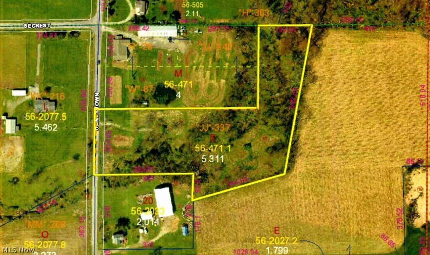 Wooded 5.3 acre parcel located on Honeytown Rd. Country living in Triway School District yet just minutes from town. The property is heavily wooded, has a peaceful running creek, and an abundance of natural wildlife. Scenic building site that is ideal for a walk out lower level.