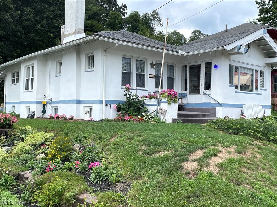 This home has loads of character, with fantastic original woodwork, cabinetry, book cases and good storage. Third bedroom on main level could be used as a terrific office, and there is a bedroom in the basement. Family owned for many years, home is in need of updates including fuse electric, selling as is. Kitchen with breakfast nook. Formal dining room with bench seat storage at window. Family room with gas fireplace, and bookcases with leaded glass. Modern gas furnace and central air. One car garage. Basement walkout area with access on public alley at rear. Enclosed front porch. Good location next to school, offices, park, and downtown. Items left in home at time of transfer stay with home.