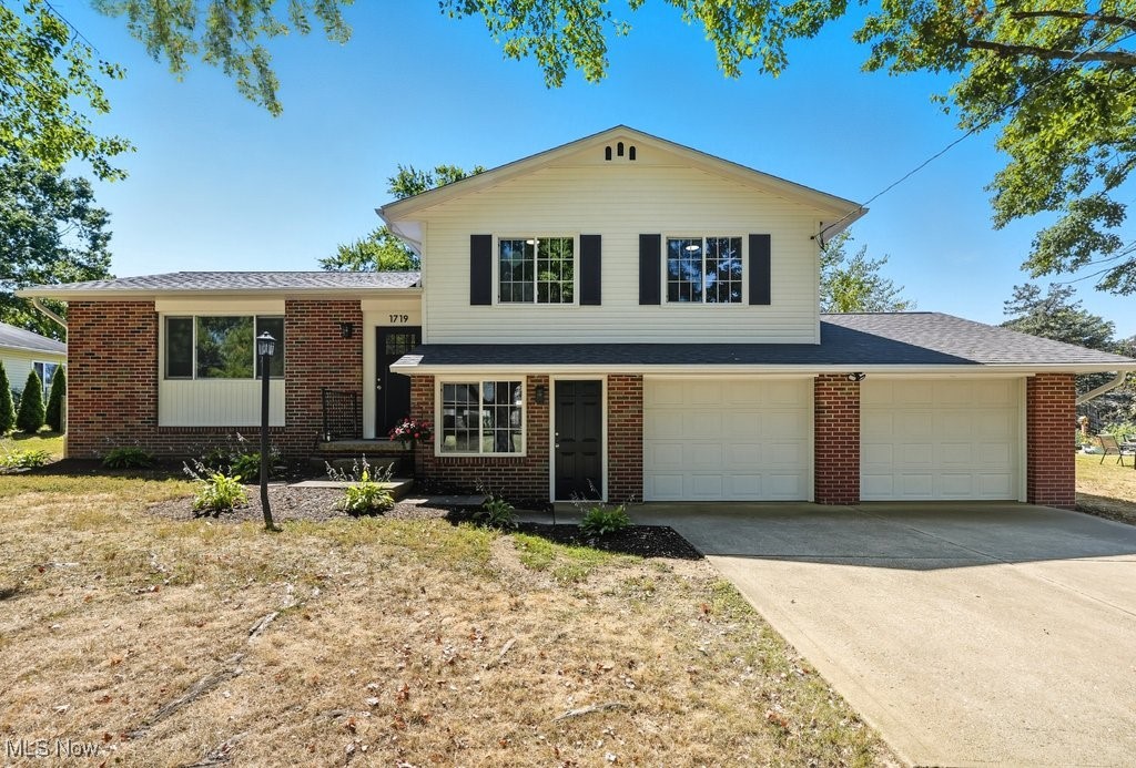 There is nothing to do but unpack and relax in this beautifully renovated home, featuring a brand-new roof, siding, and furnace. The kitchen features all-new cabinets, countertops, windows, stainless steel appliances, and waterproof laminate flooring that extends into the light-filled living and dining room. The bedrooms have new carpet, light fixtures, windows, and neutral paint. The bathroom has all-new fixtures, lighting, flooring, and cabinetry. The lower level features a spacious recreation room, a new half bath, ample storage in the unfinished area, and hookups for the washer and dryer. The back of the home has a stamped concrete patio with a fenced-in backyard storage shed. This home will not last!