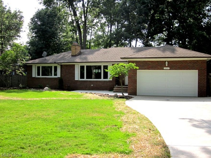 This North Olmsted, three bedroom brick ranch has been completely remodeled! This home features beautiful hardwood flooring throughout, a large light filled living room with fireplace, the NEW kitchen has abundant cabinet space, gorgeous granite counters, NEW stainless appliances, a breakfast bar, & walk in pantry. The kitchen is open to the dining room which leads to a covered back porch & stone patio for outdoor entertaining. All bedrooms are nice sizes, and both bathrooms are completely new and have natural spa like decor. Downstairs there is a spacious utility room, a bonus room, and a third room with fireplace, perfect to create a rec room. Outside there is a good size yard with full privacy fence, and nice shed for extra storage. The entire home has been re-wired, all windows are new, the AC was just installed & driveway, garage floor,  and garage door with opener are all new too! There is nothing left to do here except move in, so schedule your showing today!