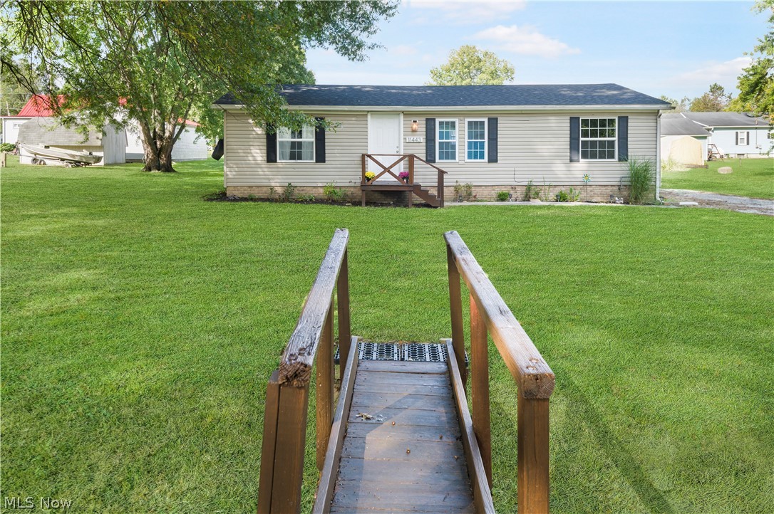 Welcome to 11443 Meadowbrook, Marlington LSD. This adorable ranch-style home has been renovated and is ready for a new owner! It sits on a private double lot at a dead-end road. This home offers an open concept great room/dining room/eat-in kitchen and three bedrooms, including the master with an updated master bath w a beautifully tiled walk-in shower, a convenient laundry area, and a second full bath. The eat-in kitchen has white cabinets, a stove & a refrigerator, a breakfast bar, and double doors from the dining area open to the rear deck. Enjoy and relax in the backyard with a fire pit and a large shed (16x10) for extra storage. This home has newer drywall (great room), laminate flooring, kitchen countertops, and windows. Updates include a new furnace, freshly painted, updated bathrooms, and a newer shed. Make an appointment for your private showing today!