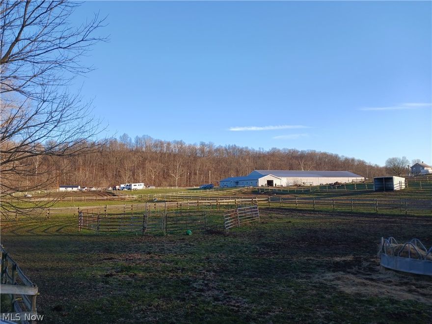 Commercial Investment property or equestrian lovers dream! Inside includes full inside riding arena . 14 stalls,10 ft concrete Isle for convivence. Two tack rooms, feed room, wash bay, inside office/ lounge with view to arena or stalls. Office is heated and has full bath and laundry area. Pole building is 184x72 with a 9 ft clearance on rafters. All surrounded by 9.022 acres of beautifully maintained fences,9 paddocks, 3 run-ins. Property is the current home for Withawind Farm. Over 20 years the property has provided hundreds of adults and children and the horses they love with lodging and training. The possibilities are endless. Perfect for shows or expos with tons of parking and central location of St Rt 339. If horses are not your hobby, this property is the perfect place to run your current business' or start a new one. No Zoning makes it your dream investment. Sky is the limit for the income that can be made right here in Washington County.