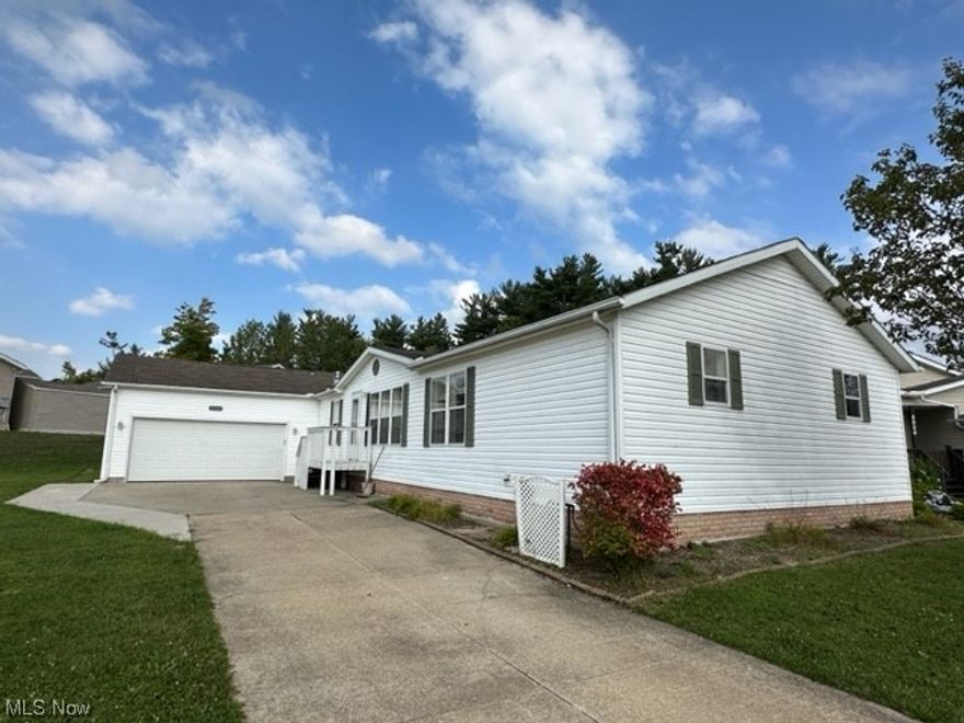 Welcome to resort-style living at Lakeside Terrace Community. Manufactured home w/4 bedrooms, 3 full baths! Shed 8 X 12. Beautiful Kitchen with island, large pantry. Covered deck off the Dining room. Beautiful home with lots of room. Large walk-through closet 10 x 6. Garage has entryway to home & also to backyard and so much more!