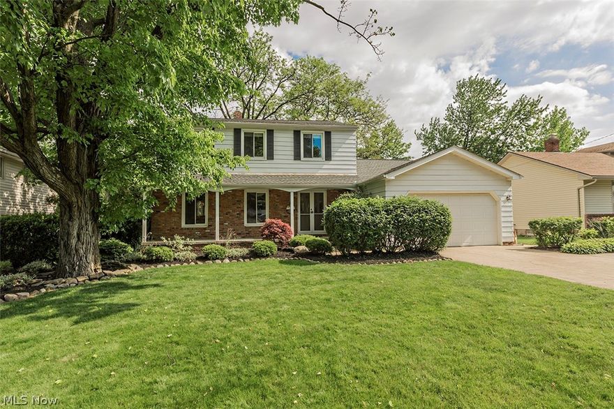 The next owners will appreciate living in this lovely Lyndhurst home.  Step up the the wonderful front porch and double doors to see all of the many features. 
The solid hardwood floors in the living and dining rooms shine and lead to the wonderfully updated kitchen with subzero refrigerator, granite cabinets.  The eat-in kitchen is open the the terrific step down family room which is anchored by the around the rustic brick fireplace and mantle.  The dream laundry is on the first floor, near the attached garage (w/new smart garage opener) updated half bath.  The easy flow on the main level brings natural light at every turn.  The second floor is complete with wonderful master bedroom and bath, three more spacious bedrooms and 2nd full bath.  The partially finished lower level features an expansive recreation room AND NEW MECHANICS installed in 2020 including Furnace, Air Conditioning, H2O Heater!  Roof less than 5 years.  The deck AND stone patio along with full privacy fence is a per