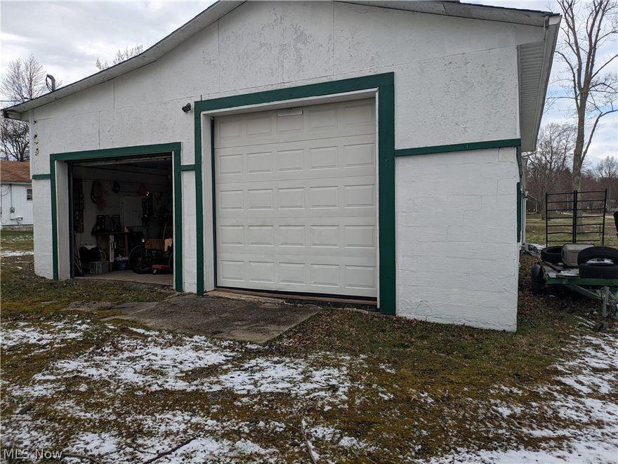 Residential dwelling with bathroom converted to apartment/auto repair located on over 1/2 acre.  Perfect for auto-mechanic, collector, storage, etc., ready for your own custom personalized space!