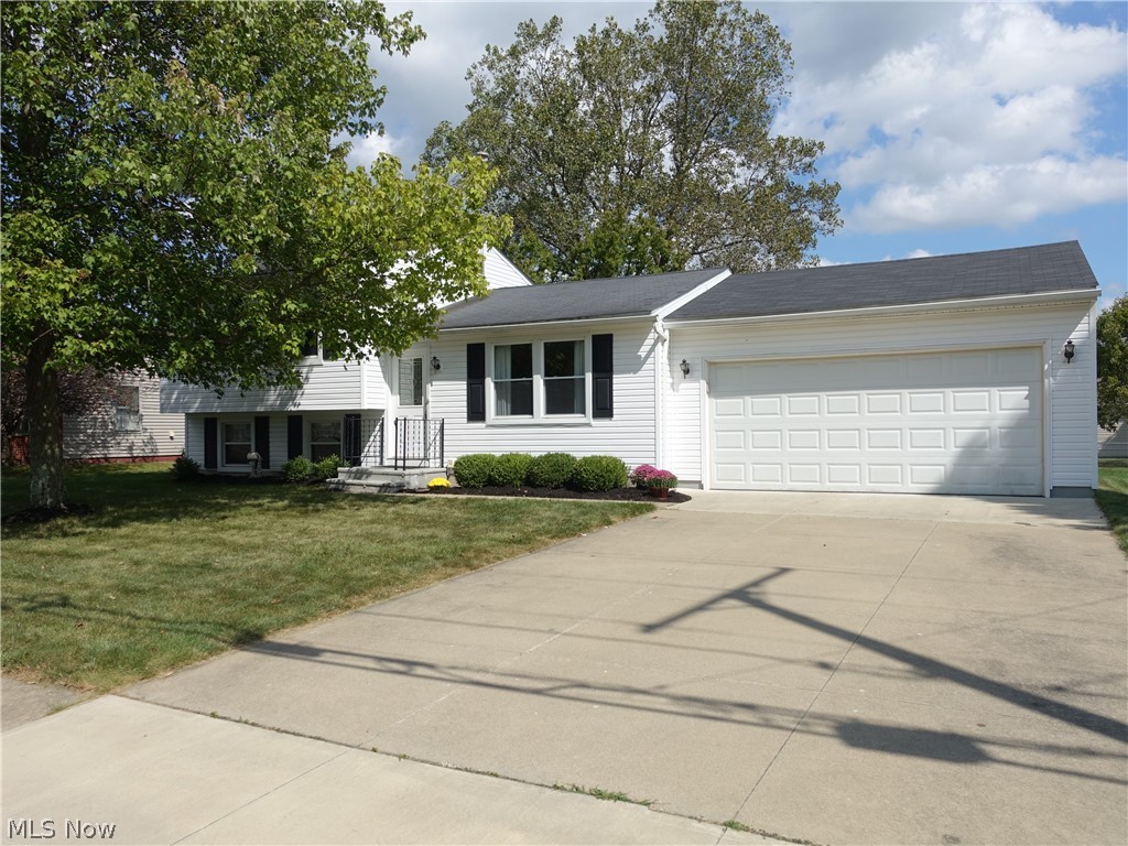 Looking for 1st floor living and a well loved/maintained home? This is it! Larger than it looks split offering a huge addition with 1st floor master, full bath with walk in shower, large entry off the garage is perfect for a large "drop zone"/mud room with sliders to a nice deck. The spacious living room is open to very nice eat in kitchen with plenty of cabinet and counter space (appliances convey). The 2nd floor features 3 more bedrooms with nice closet space and full bath. The lower level offers a nice recreation room and office with walk out. Attached 2 car garage currently has a ramp into the home. Furnace/AC 2015 and newer windows. The backyard is level and is fenced in. Home warranty offered for peace of mind.