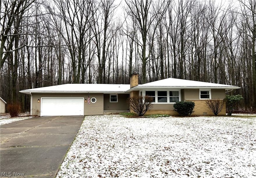 Freshly updated and located on a quite dead-end street with wooded views, this 3-bedroom, 2-bath ranch with full unfinished basement is just what you are looking for.  Open kitchen, dining area and family room.  White kitchen cabinets, granite counters and tile backsplash.  Room for a wine fridge in the island that also has a bar overhang for chairs.  Open family room with built-in hutch and sliders off the back to a deck and wooded view.   Other kitchen features - soft close drawers, lazy Susan, slide out shelves, nickel accents.  Living room features a gas fireplace and hardwood flooring.  Master bedroom has a bath w/ shower - new vanity, granite counter, vanity light, toilet, faucet and showerhead.  2nd full bath features a walk in shower w/ glass sliding door, newer vanity, granite counter, faucet and toilet.  Hardwood flooring or tile throughout the home. Most light fixtures and all ceiling fans are new. Full unfinished painted basement and partial concrete crawlspace for great am