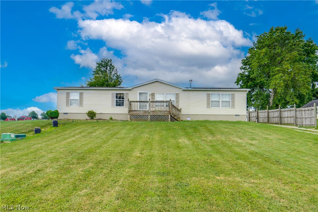 You’ll find such a picturesque setting in this Louisville home. Not just a country setting on a .5 acre lot but the home itself offers 1800 square feet with 4 bedrooms and 2 full baths. With everything on one floor, you’ll love the convenience and the floor plan. There are 3 bedrooms on one side plus the owner’s area on the other. The main living space features not one but two living areas, one with a fireplace and one that’s vaulted and more cozy. The kitchen has an eating bar, all appliances, and a separate dinette. Off the kitchen is a convenient laundry room/mud room area which also leads to the outside. The owner’s bedroom has a large walk-in closet along with a garden tub and shower in the owner’s bath. One of the best features is the attached 24x42, 4-car garage with electricity, lighting, concrete floor, water, and ready for propane. Need more coverage? Four more carports are providing all the space you may need. Separating the garage and the house is a nicely sized patio ready for your grill and furniture for outside relaxation. A quick drive will allow highway access in any direction. Let’s schedule your tour and show you more of what this home has to offer!