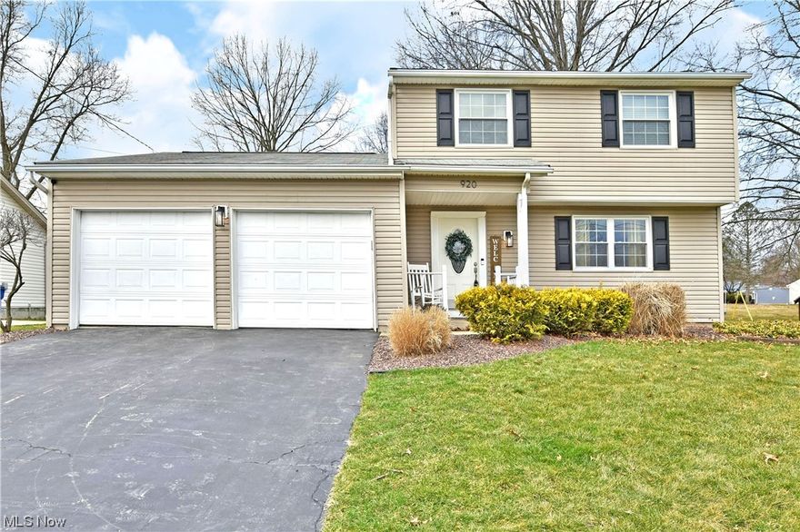 Excitement awaits this gorgeous two-story McDonald residence, offering tasteful updates throughout its beautifully showcased three floors of living space to include a finished basement! The handsome home stands proudly atop its sloping drive with its thoughtful landscaping and picket lines front porch. The stonework continues around the back as shapely pavers lend to a covered cabana area with unique steel roof. Step past the decorative entry door to find the tiled foyer set before a carpeted staircase. The living room is awash in natural light, cascading across the dark hardwood styled flooring. Soothing gray walls extend out towards the formal dining room at the far side of the hall. Revel in the central kitchen as granite styled countertops shimmer beneath bespoke overhead lighting. Faux brick work adds to the ambiance. A lovely half bath is located near garage and basement access. Meanwhile, the illustrious family room enjoys French doors leading to the rear patio and a white brick