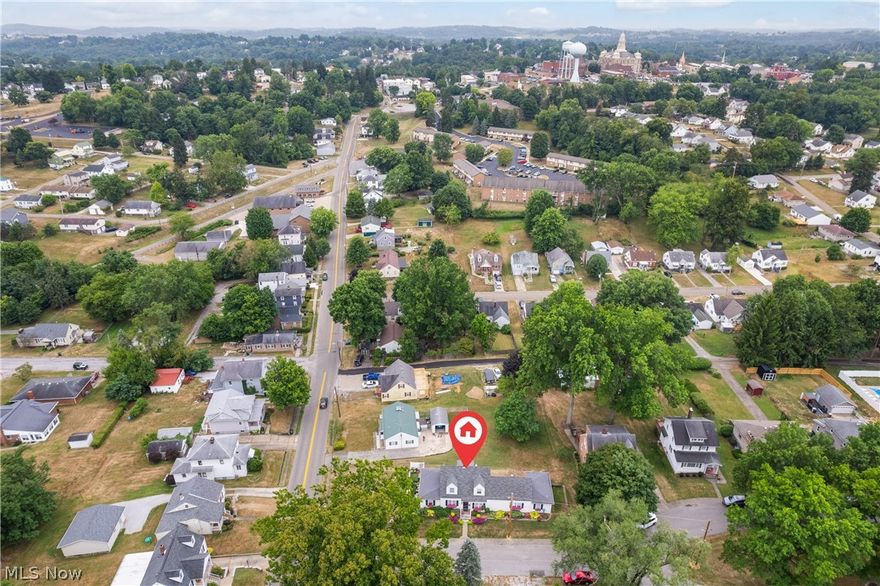 Captivating Cape Cod located in one of St Clairsville most desirable neighborhoods. This traditional 3 bed, 3 full bath, 3 car garage home boasts a plethora of custom woodworking treasures throughout. The owner has created numerous built in masterpieces from the floor to ceiling bookcases in the family room/ media room,  Mantles and lighted wall to wall units in the welcoming living room, and custom kitchen cabinets and pantry in the delightful kitchen.  This home is sure to amaze the most scrupulous buyer with its attention to detail through out with wooden cornices, dentil molding, built in window seat and original hardwood flooring.  The stunning and serene first floor Master Suite features built-ins, his and hers closets, changing area with master bath.  The laundry room is located off the master suite and is a must see.  The upstairs contains Two bedrooms with a full bath, Office and bonus area.    This Immaculate and Pristine home is full of classic charm..  Basement plumbed for a half bath.   Don't miss your opportunity to call this gem your home. Home was remodeled and updated beginning in 2005 with square footage added, Plumbing and electric updated. 2 Furnaces, A/C unit are approximately 5 years old, one of the central air units is not.  Main house roof 5 yrs old while additions were roofed in 2007 when additions were added.   Call your agent for a private showing.  Only pre approved buyers please.