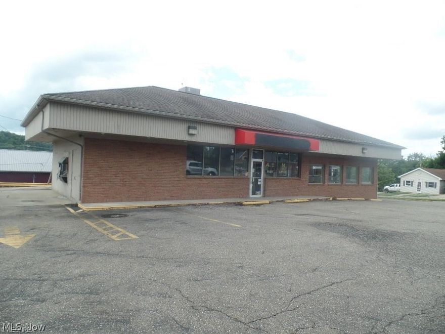 Great commercial location for a business. Corner lot w/lots of off street parking. Previously a drive-thru carryout. The building is situated on two lots - 50'x125' and 74'x125'.  Low maintenance and all one floor.