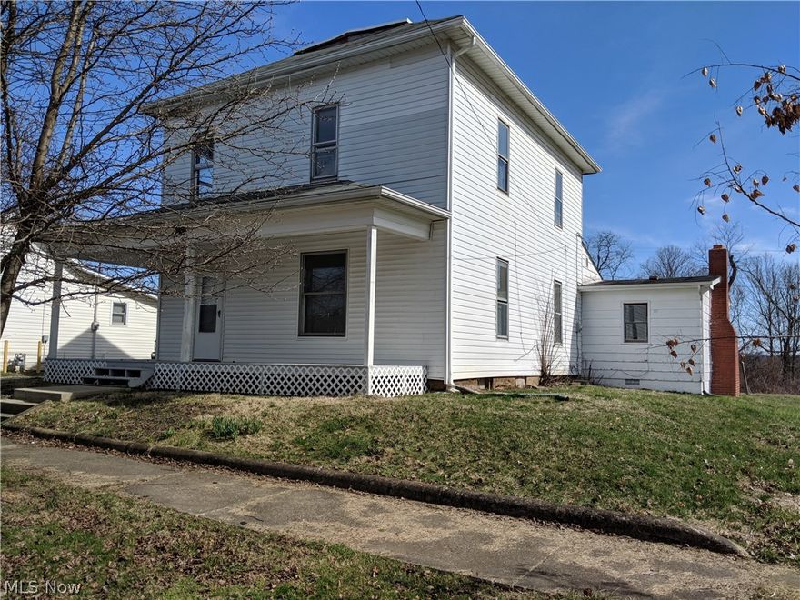 PRICED TO SELL! This 3 bedroom, 1 full bath house will be a great starter or investment property.  A vacant lot adjacent to this property is included.  Featuring beautiful woodwork and over 2100 sq. ft of living space.  Washer and dryer hook-up is on the 1st floor.  Plenty of closet space for an older house. Additional room off the dining room (former kitchen) can be used as a pantry or additional storage.  New front porch within the last 2 years.  Plenty of yard space for outdoor activities.  Structurally sound house, just needs a personal touch on the inside to make it a home.  High ceilings gives it character.  Schedule your showing today.