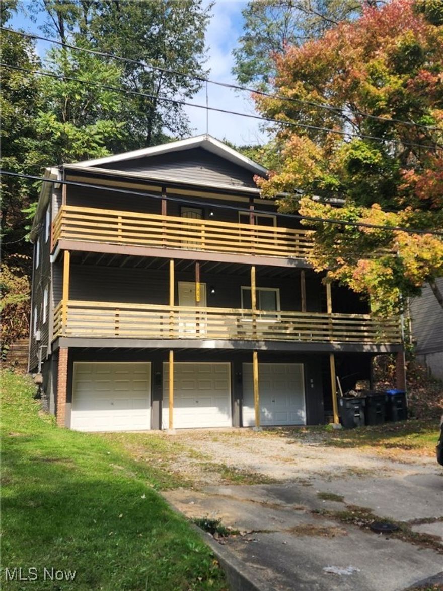 Beautifully redone duplex on very quiet dead end street with attached 3 car garage.  Brand new deck, brand new appliances, brand new flooring, new furnace, new hot water tank.  This is completely turn key.

Bottom unit is fully rented on lease at $850 a month.