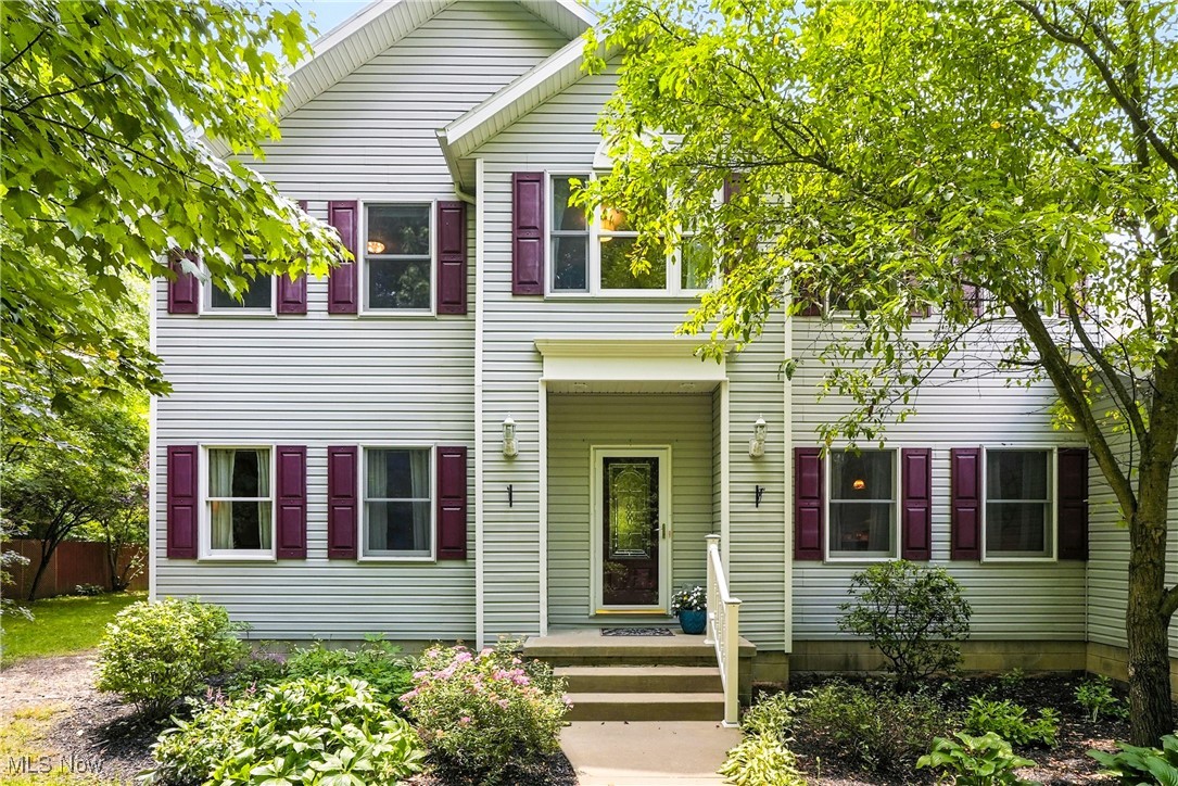 Located in the highly sought-after Highland Local School District and offering quick access to Fairlawn, Akron, and Cleveland, this beautifully maintained Colonial at 7734 Katie Drive is a true standout. Set on a peaceful and private lot, this home blends timeless elegance with luxurious updates and thoughtful design throughout. Rich Brazilian Cherrywood flooring flows through the main living areas, creating a warm and inviting atmosphere. The gourmet kitchen is a showstopper, featuring a striking marble island, granite countertops, and custom cabinetry, and it opens seamlessly to the living room and a stunning four-season sunroom. The sunroom, complete with a fireplace and tranquil views of the stocked pond, leads directly to a professionally designed brick patio with a built-in outdoor fireplace—ideal for entertaining or quiet evenings under the stars. The home offers two primary suites, including one on the main level with a spa-like bathroom that includes a jetted tub, walk-in shower, and walk-in closet, as well as an attached office with removable built-ins. A second primary suite upstairs includes its own full bath and spacious closet. Two additional bedrooms, a full bathroom, and a large bonus room provide flexible space for guests, recreation, or home office use. Additional highlights include a first-floor laundry room, fresh paint and new carpet in 2025, a whole-home generator, an outdoor shed, a three-car garage, and a large, clean lower level offering excellent storage or future finishing potential. With its blend of comfort, quality, and location, 7734 Katie Drive is a remarkable opportunity to own a custom home in one of the area's most desirable communities.