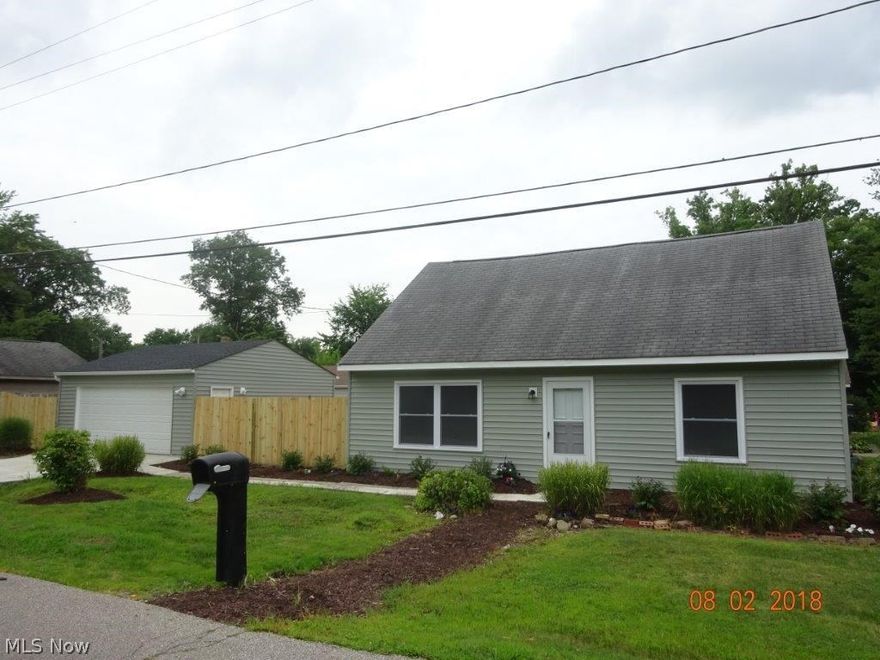 Fabulous 4 bedroom home. Nothing to do but move in and add your finishing touches. Improvements include a new 2 car garage and concrete pad, vinyl siding, windows, boiler, kitchen cabinets & counter, back door, laundry tub, electrical box, storm doors, updated bathrooms, new flooring throughout (laminate and carpeting). All freshly painted. Wood privacy fence. New lawn seeded in back. Nicely landscaped. Hurry! Hurry!