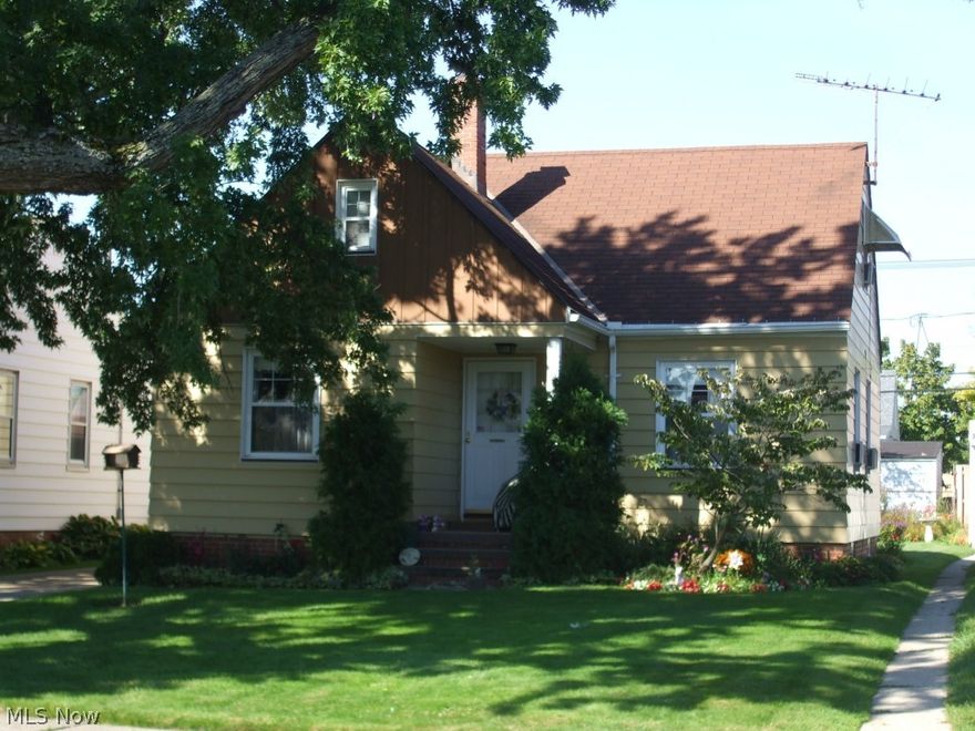 Excellent opportunity to own this clean and well-cared for cape cod in West Park! Hardwood floors throughout the whole house except the bathroom and kitchen! Spacious living room with fireplace, bright and welcoming eat-in kitchen with newer appliances included! 2 nice sized bedrooms and bath on the main floor and 1 large bedroom upstairs with a bonus room/playroom! Built in cubbies, drawers and closets.  Full basement with large glass block windows and additional bathroom with shower.  Oversized 2.5 car garage for the car buff or any other hobbies!  Beautiful yard with many flowers and plantings and a nice sized front porch to enjoy the shade of a large maple tree. **1 year, Supreme Home Warranty included for the new owner's peace of mind!**