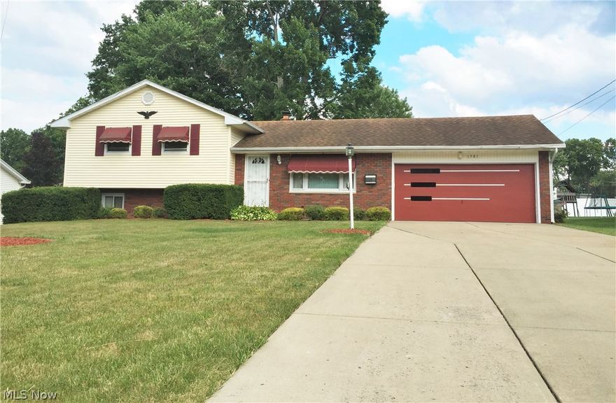 Welcome to 1781 Lancaster Drive, this home is move in ready and is larger than it looks. Main level includes living room, remodeled kitchen with plenty of modern white cabinets, ceramic tile floor and back splash, recessed lighting and eating area and a sunroom. Upper level consists of three bedrooms, all with wood floors under carpet and an updated full bath with large vanity. Lower level has a large family room and separate area that could be a den or made into a bedroom with minimal effort, lower level bath has a tile shower. Basement is clean  and dry. The sunroom leads out to a concrete patio and fenced rear yard. The two car garage has a workshop attached with plenty of shelving for storage, there is also a shed in the rear of the property. Updates include; Central A/C, remodeled kitchen and upstairs bath, HWT, curbing around landscape, concrete patio, vinyl fence, shingles, some light fixtures.